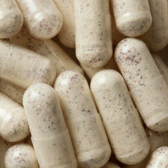 Close-up of WELLBEL Men capsules offering a convenient three-capsule daily dose