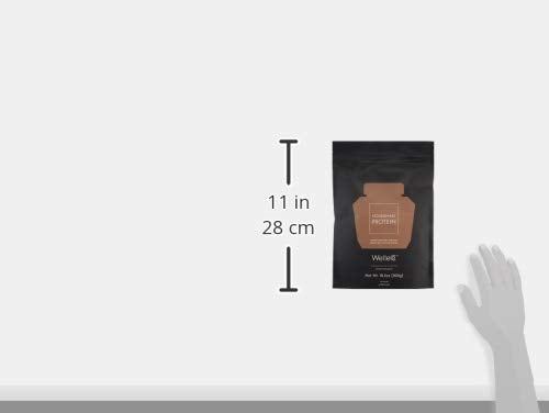 Serving idea: WelleCo protein shake with toppings and spoon.