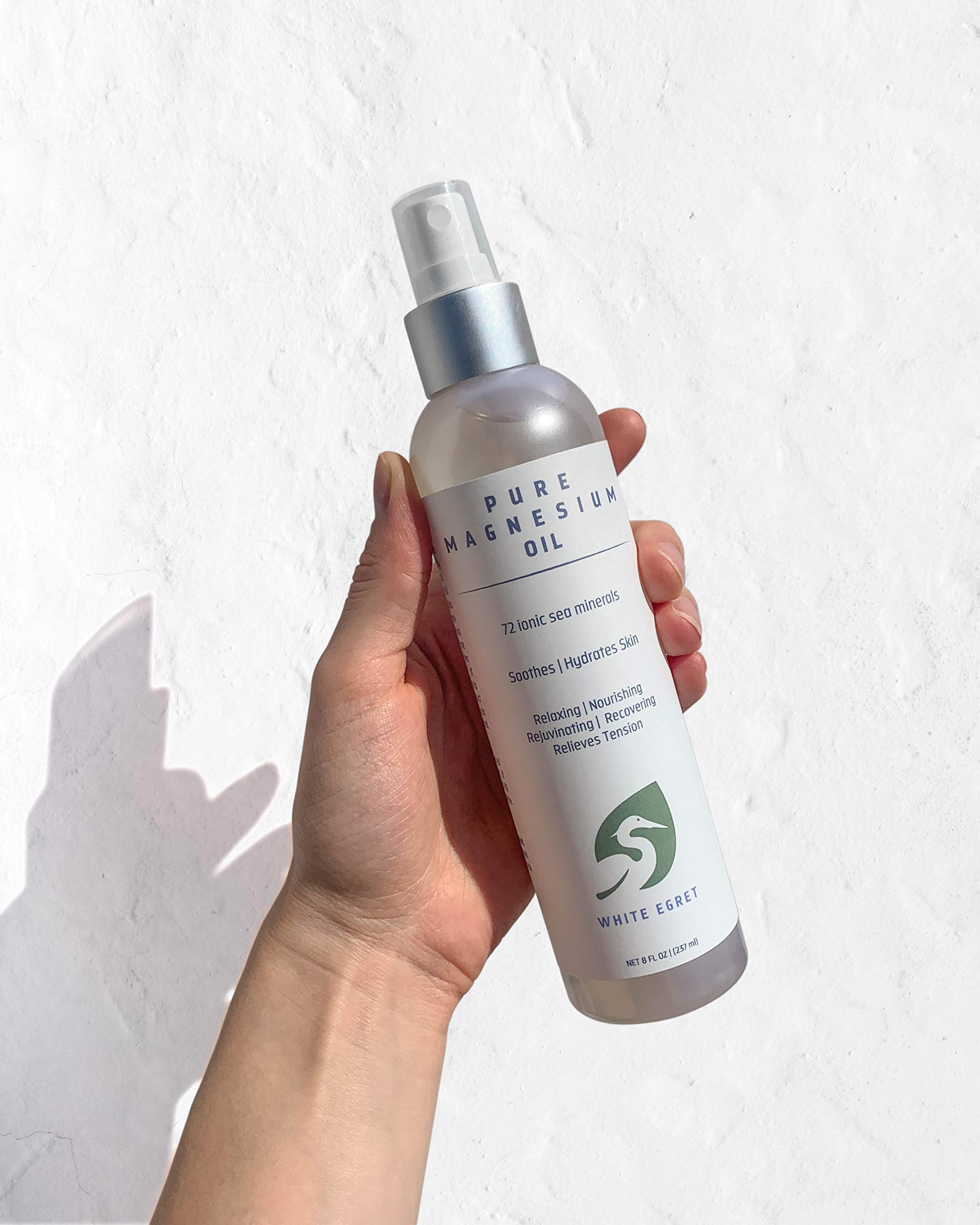 White Egret Magnesium Beauty Oil applied to skin nourishes and adds a gentle glow.