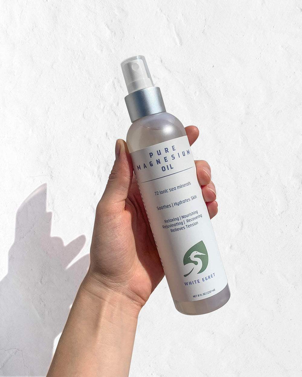 White Egret Magnesium Beauty Oil applied to skin nourishes and adds a gentle glow.