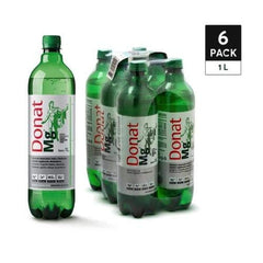 Pouring Wholefood Earth Donat Mg water into a glass for refreshing hydration