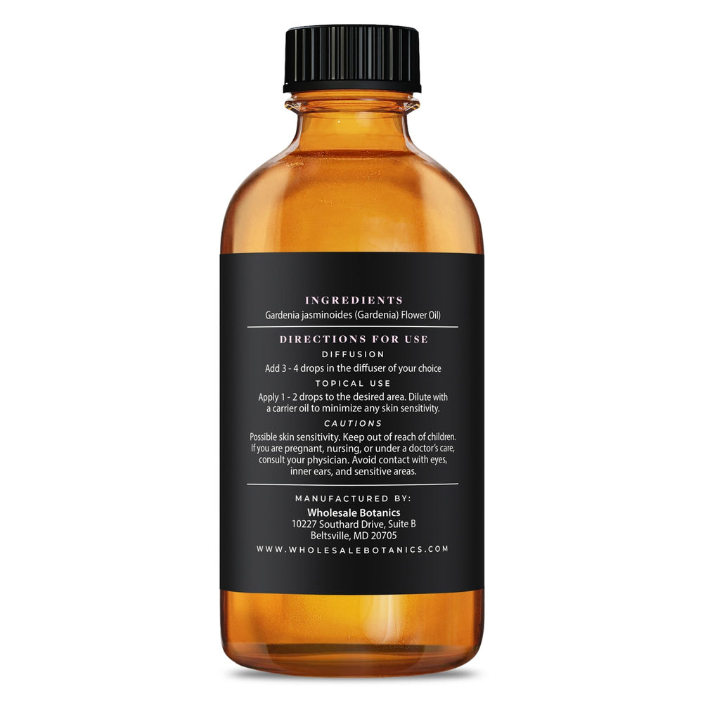 Wholesale Botanics Gardenia essential oil beside candles and soaps shows versatile DIY fragrance options.