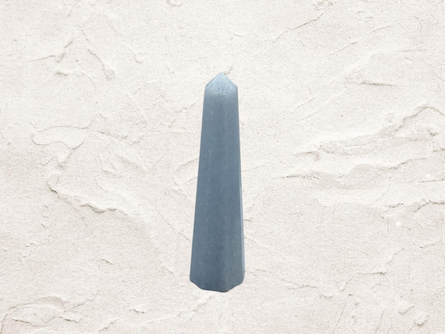 Wholesale Gem Shop Blue Calcite Obelisk enhances desk display and tranquil ambience.