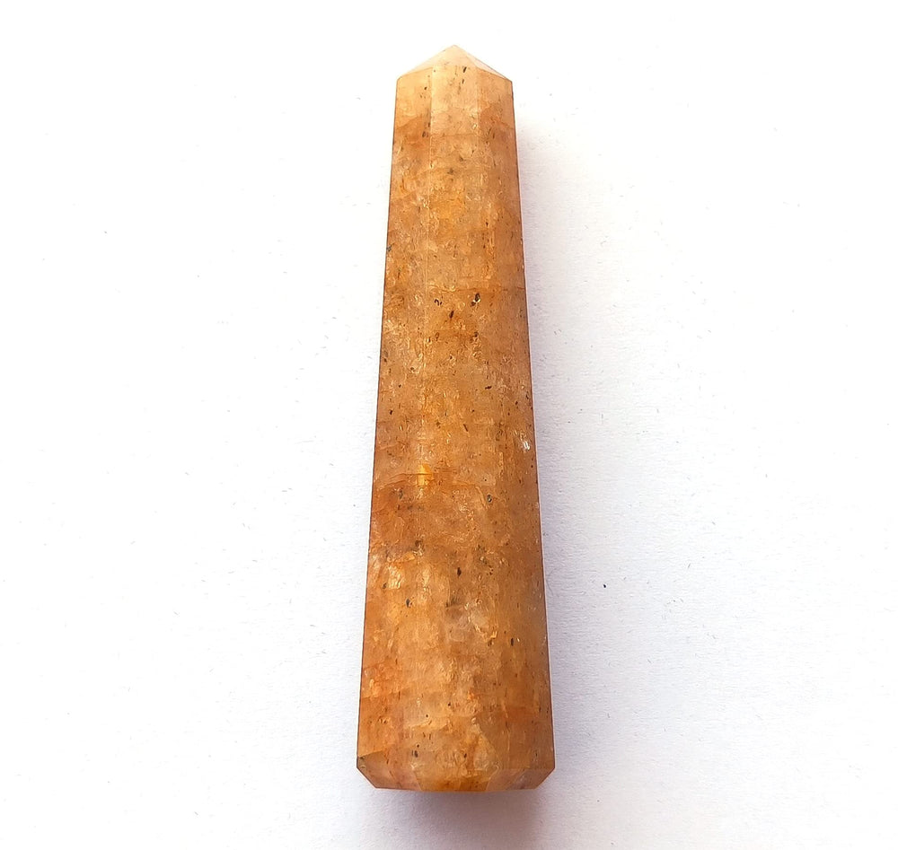 Wholesale Gem Shop Hand-carved obelisk showcases natural texture.