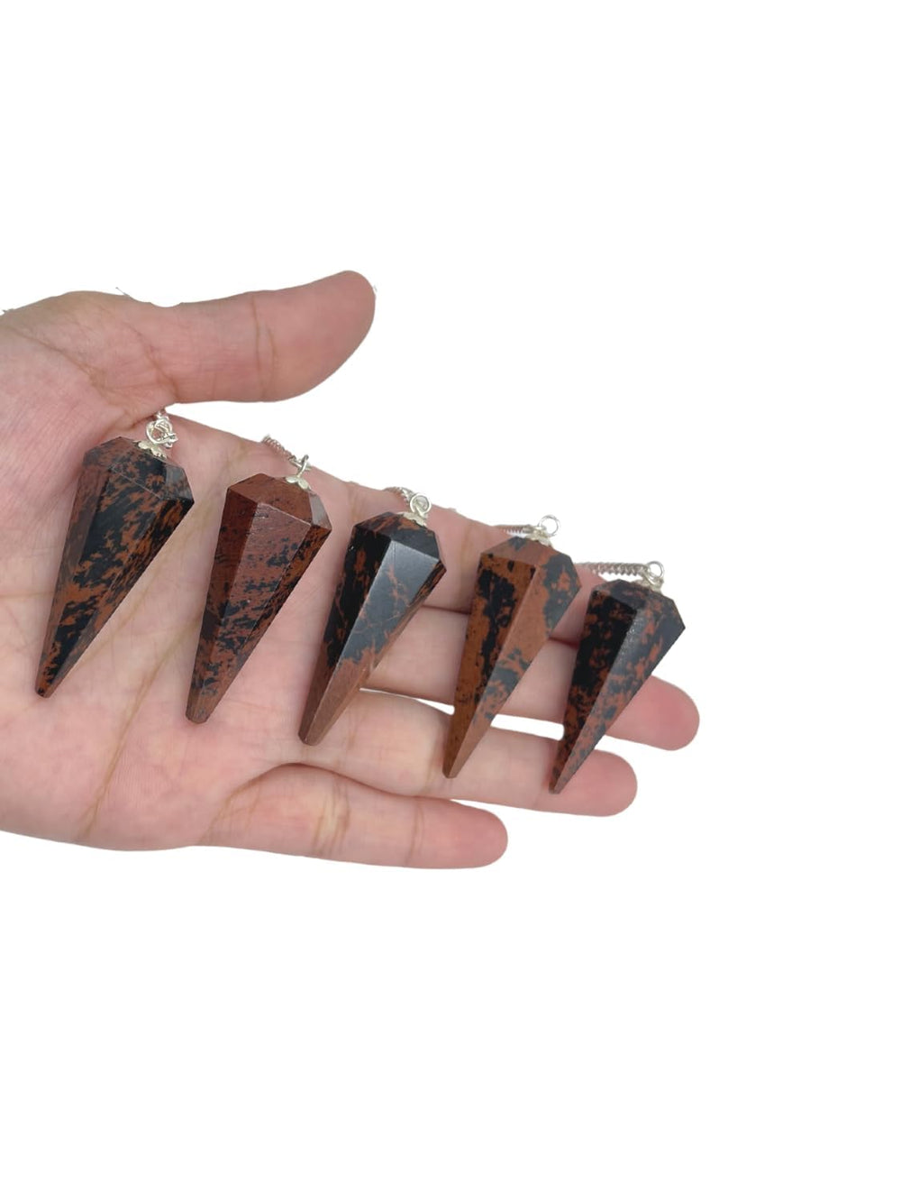 Wholesale Gem Shop mahogany obsidian pendulum on desk during mindful practice