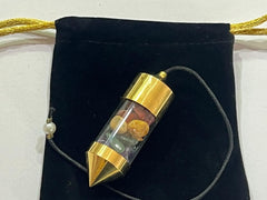 Closeup of Wholesale Gem Shop brass pendulum highlighting balanced design