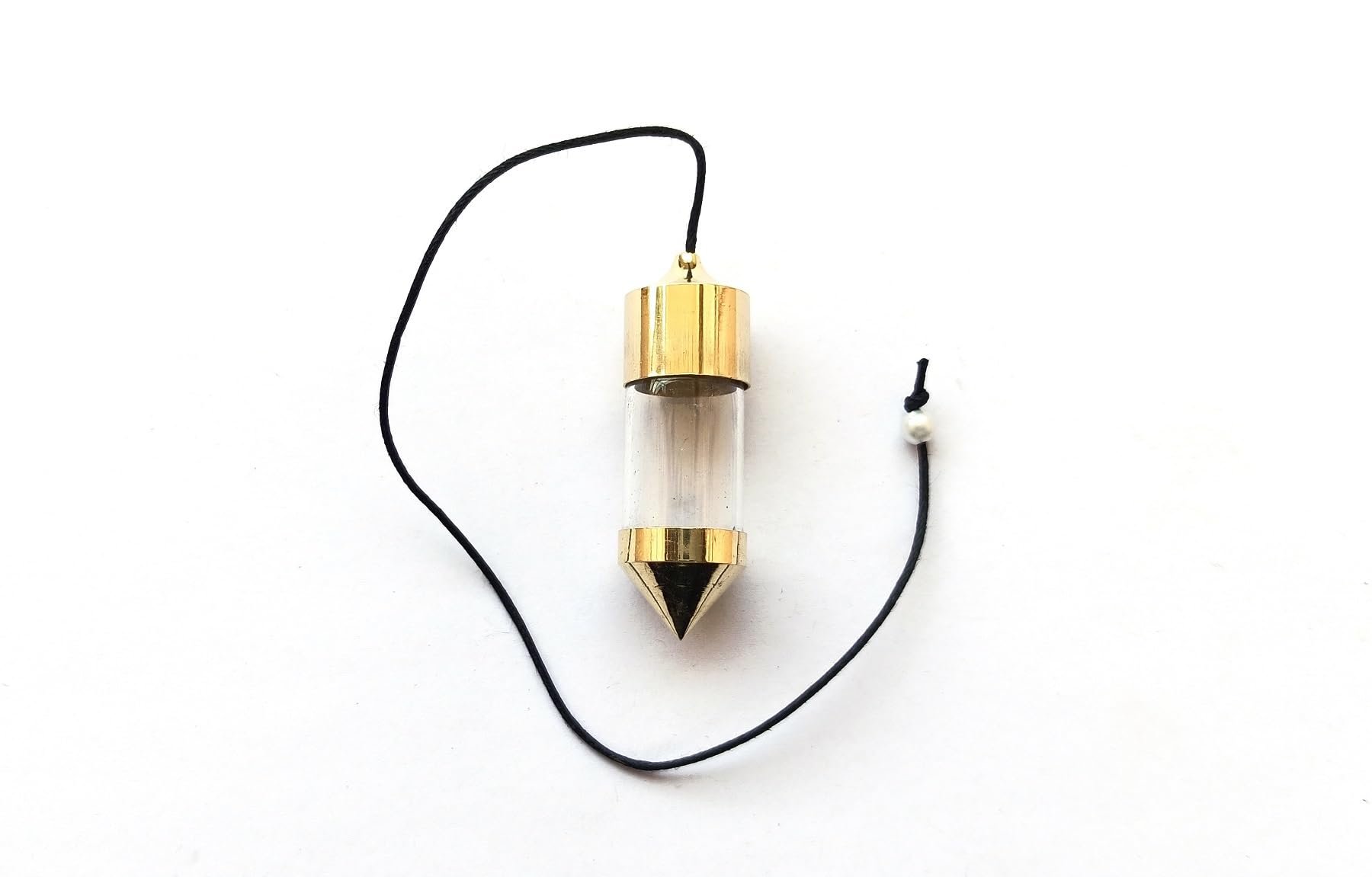 Wholesale Gem Shop brass pendulum held for a reflective session