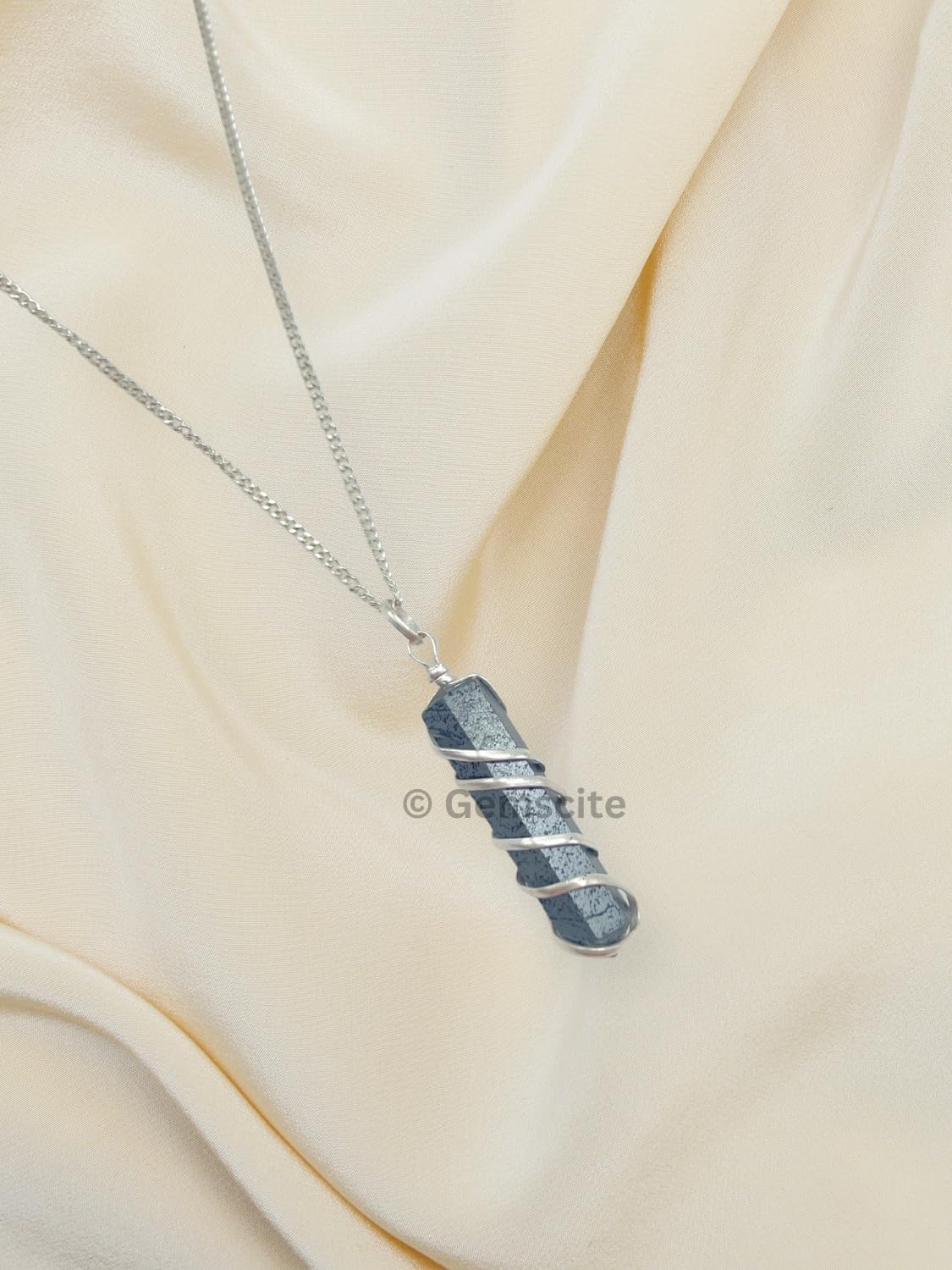 Wholesale Gem Shop chakra crystal pendant demonstrating energy focus and mindful balance.