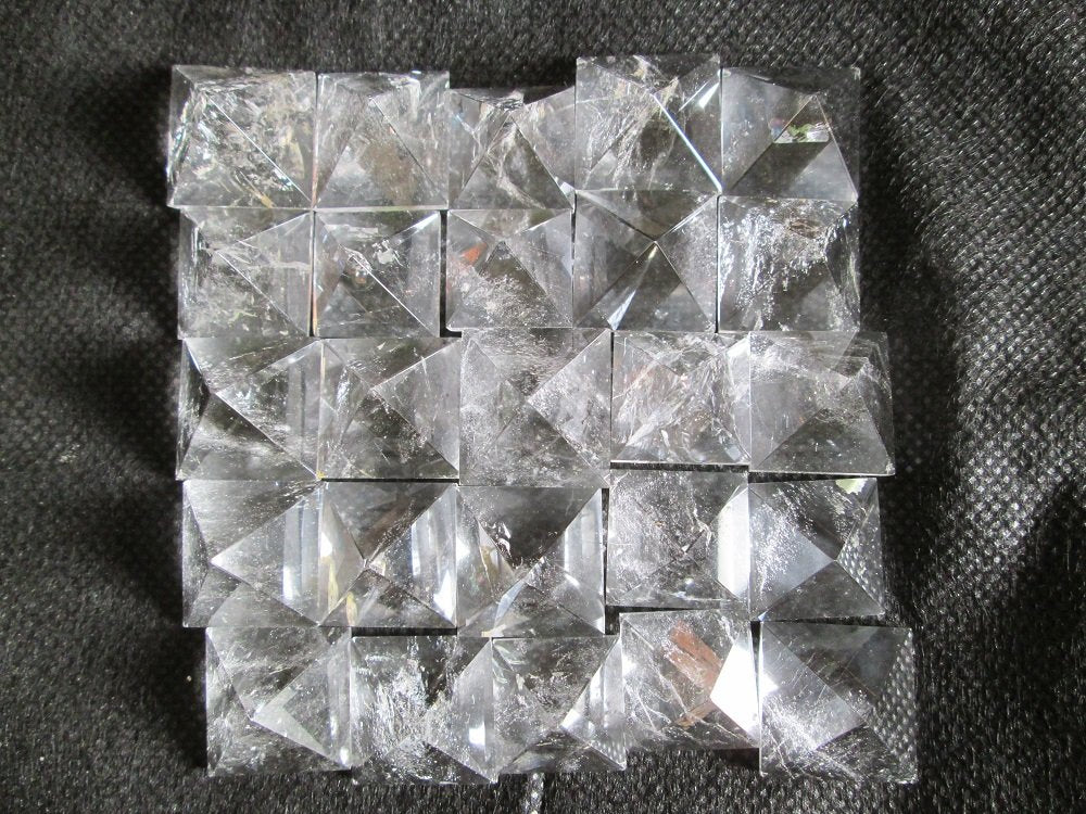 Wholesale Gem Shop crystal quartz pyramid set 12x16mm for focus and energy rituals.