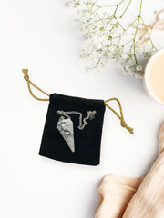 WholesaleGemShop Howlite pendulum in velvet pouch for elegant gifting.