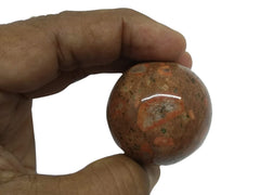 Wholesale Gem Shop Picasso Jasper sphere on altar fosters focus and calm.