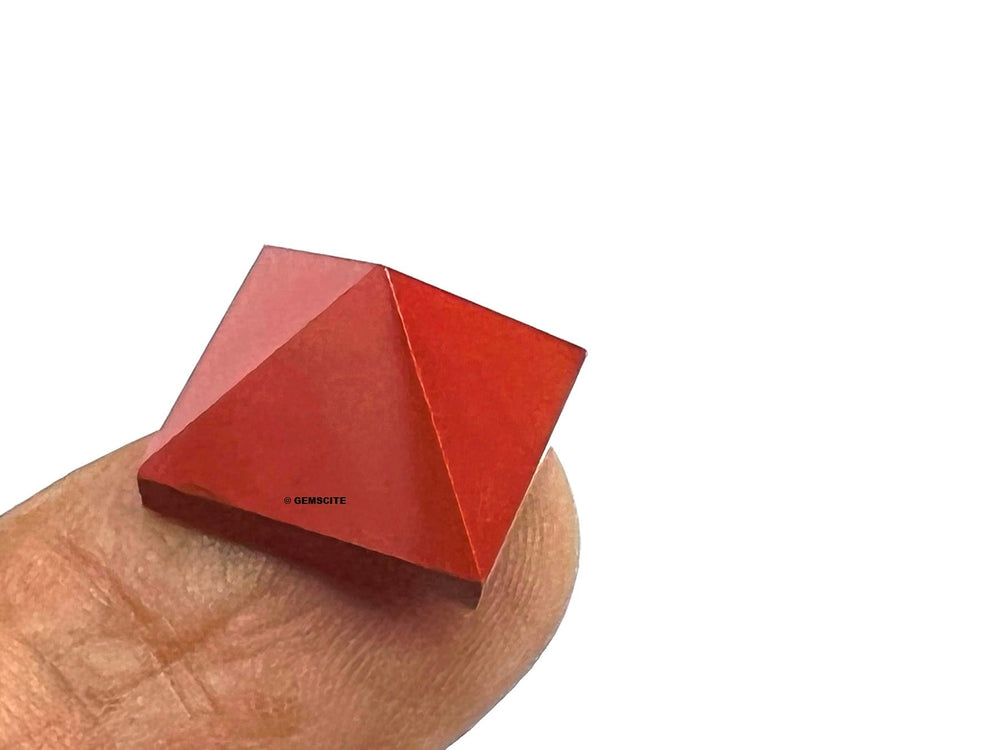 Red Jasper pyramid on desk for meditation and calm.