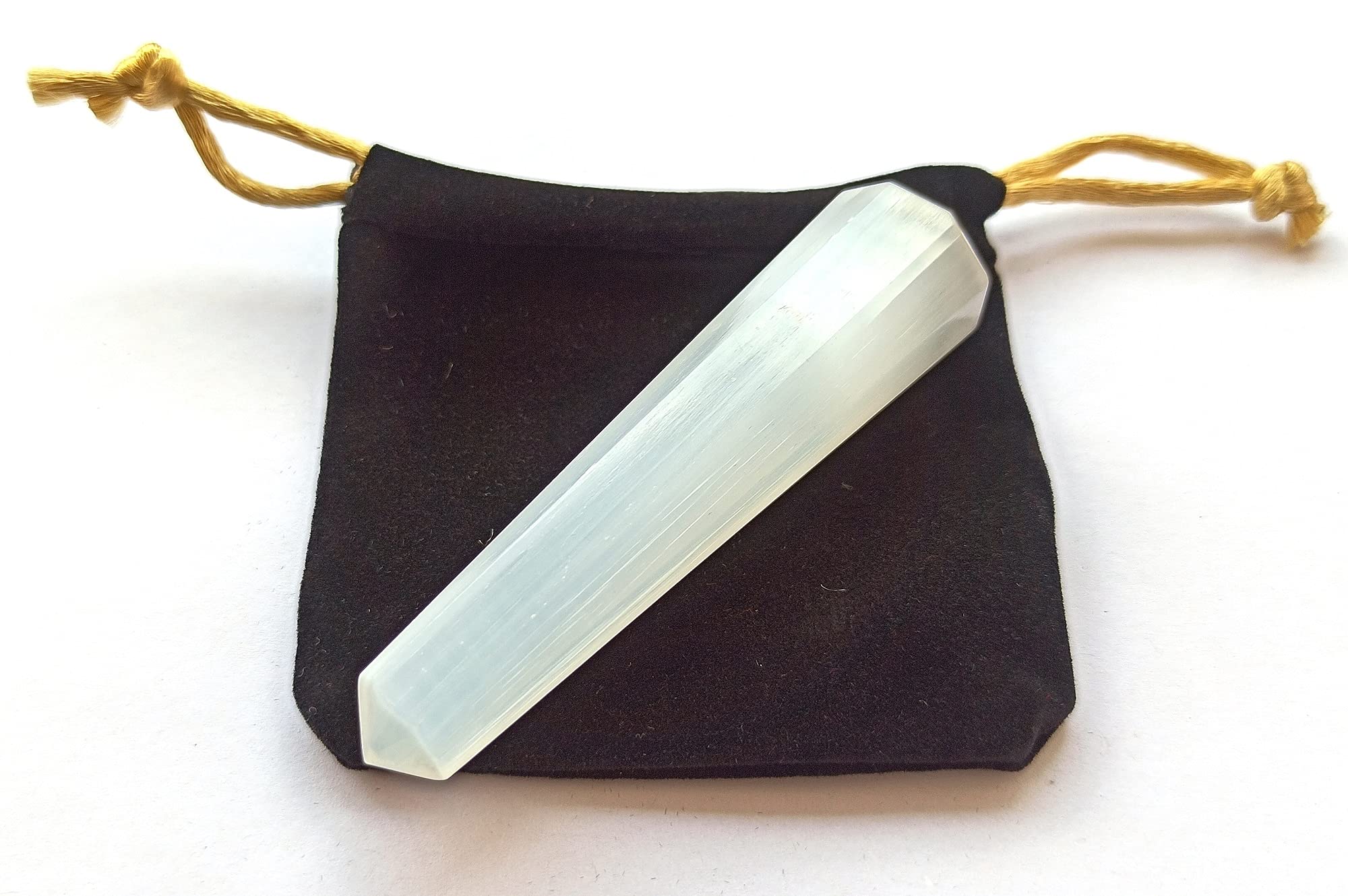 Wholesale Gem Shop selenite obelisk 70mm tip concentrates energy at the apex for meditation.