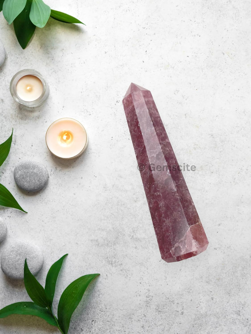 WholesaleGemShop Strawberry Quartz Obelisk on display altar enhances calm ambiance