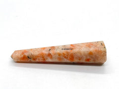 Wholesale Gem Shop sunstone obelisk texture highlights earthy color variations.