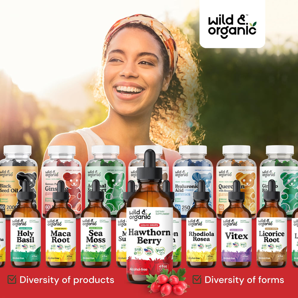 Wild & Organic Hawthorn Berry Tincture drops over a glass