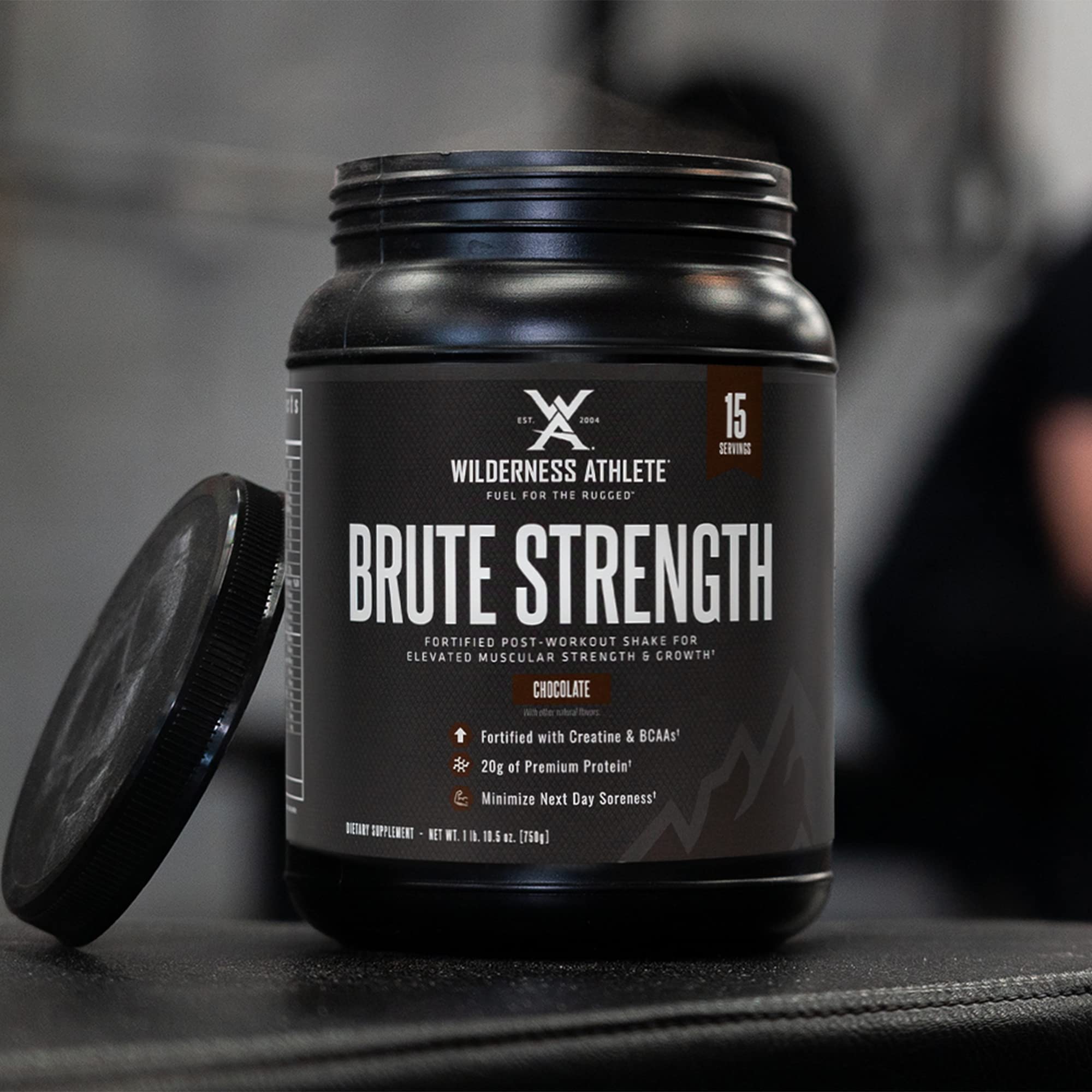 Wilderness Athlete Brute Strength scoop dispensing powder for quick protein and creatine intake