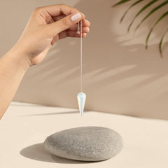 Wish Well Opalite pendulum during meditation aids intuition and inner clarity.