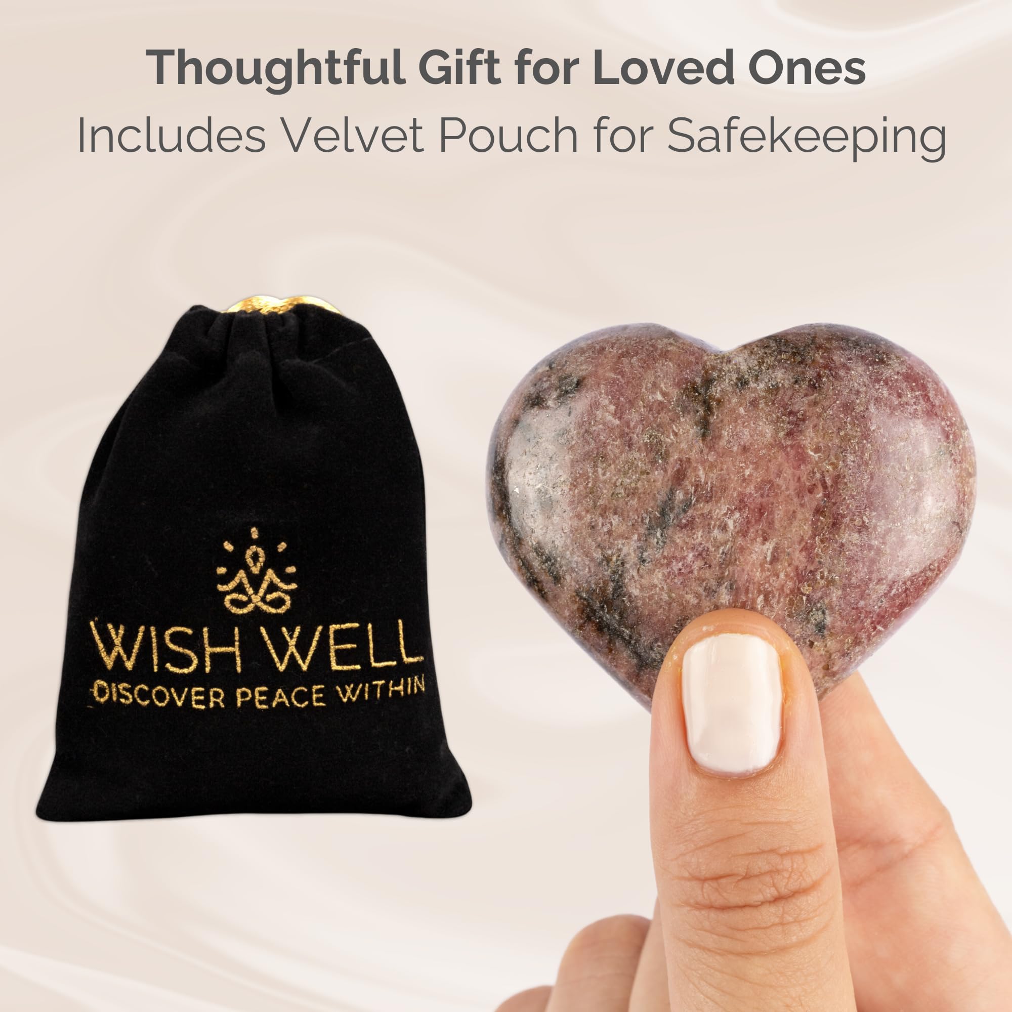 Wish Well Rhodonite heart stone on an altar during Reiki or chakra work