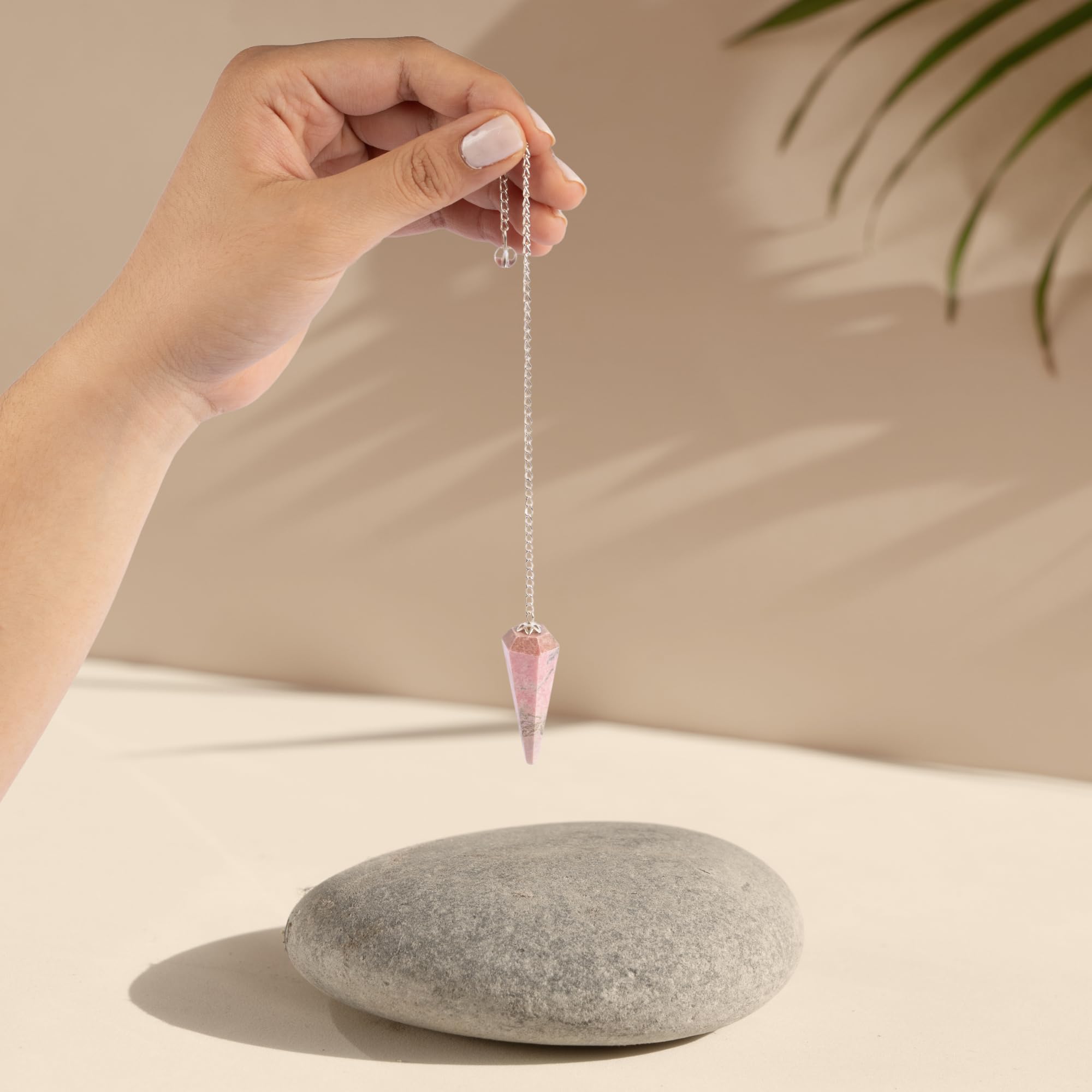 Wish Well rhodonite pendulum chain highlighting craftsmanship for energy work.
