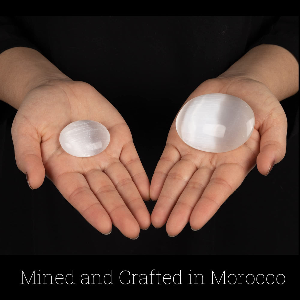Wish Well selenite palm stone polished surface invites mindful handling.