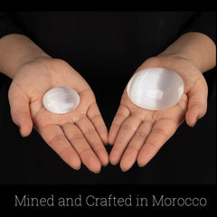 Wish Well selenite palm stone polished surface invites mindful handling.