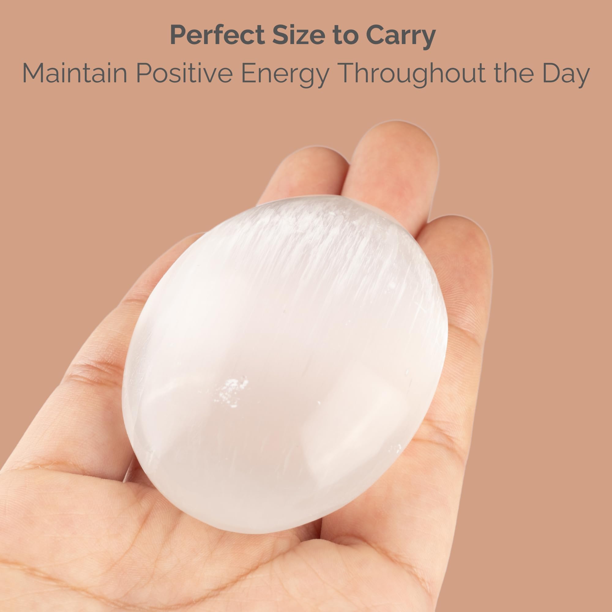 Wish Well selenite palm stone in hand for tactile calm relief.