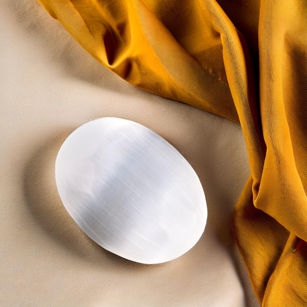 Wish Well selenite palm stone used as a worry-stone during daily moments.