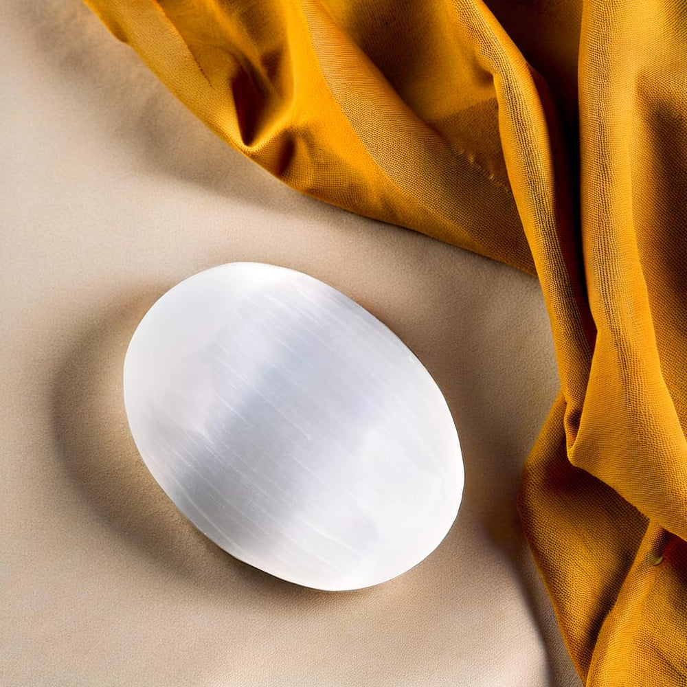 Wish Well selenite palm stone used as a worry-stone during daily moments.