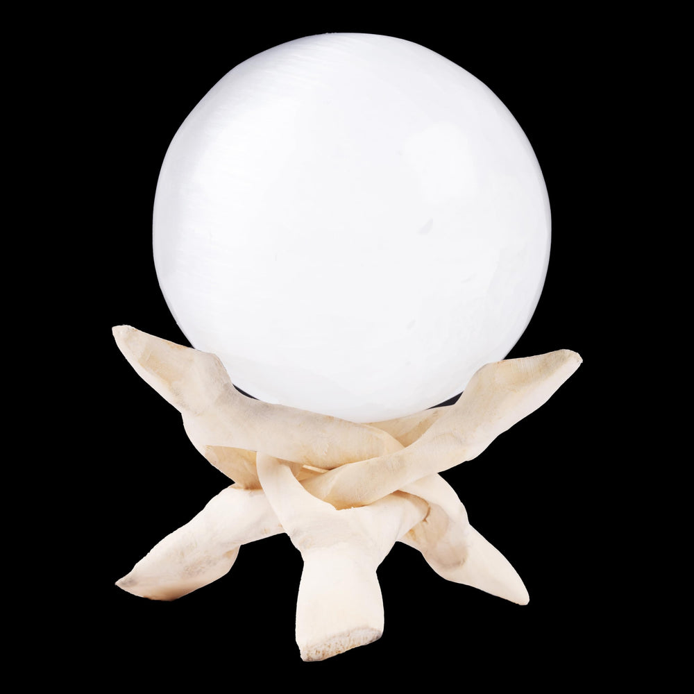 Wish Well selenite sphere, 3.14 inches, on a desk for calm and focus.