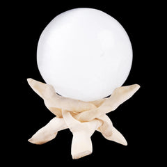 Wish Well selenite sphere, 3.14 inches, on a desk for calm and focus.