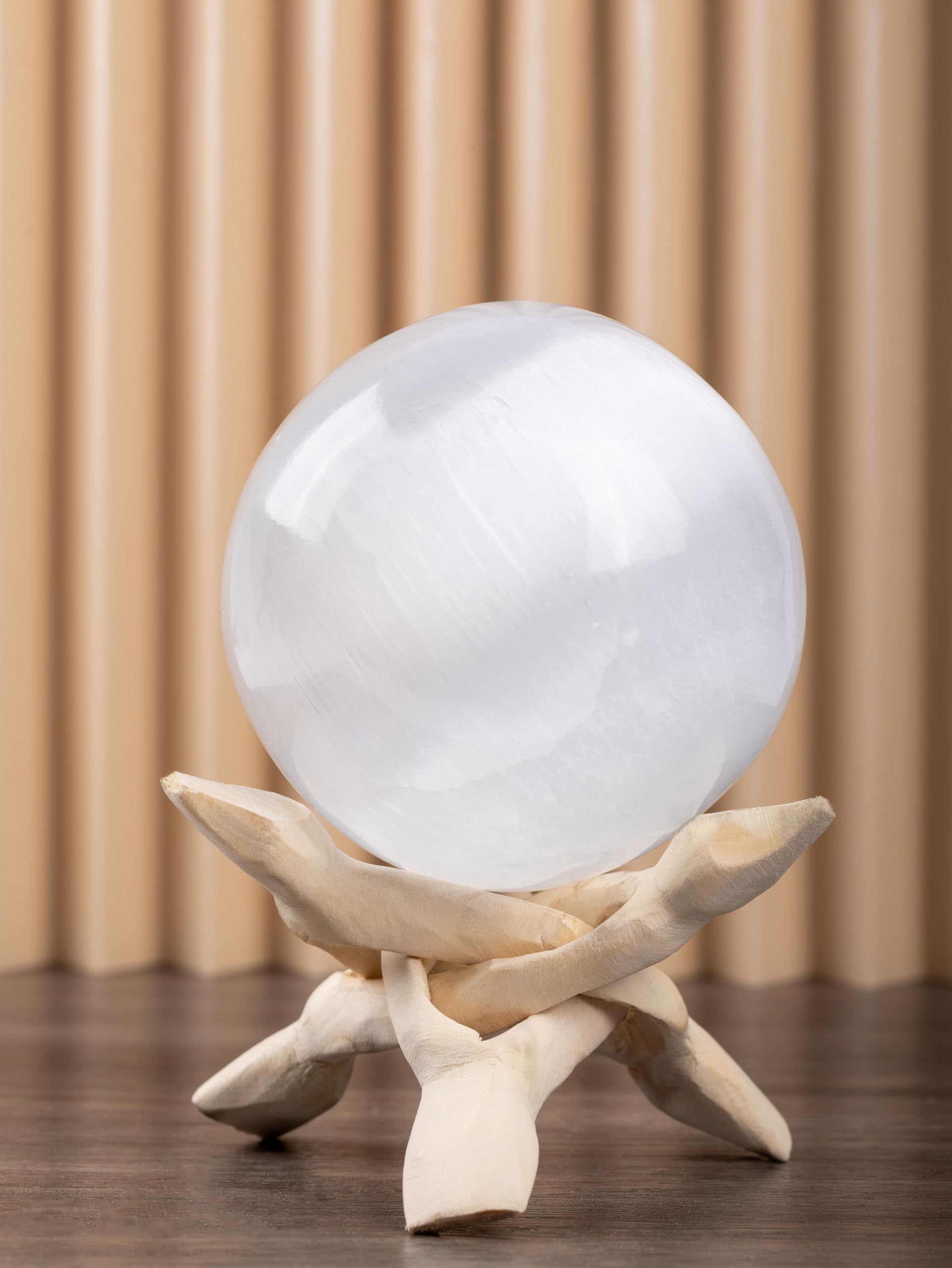 Wish Well selenite sphere on an altar for tranquil meditation focus.