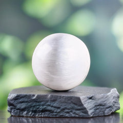 Wish Well selenite sphere on a shelf adds refined ambience.