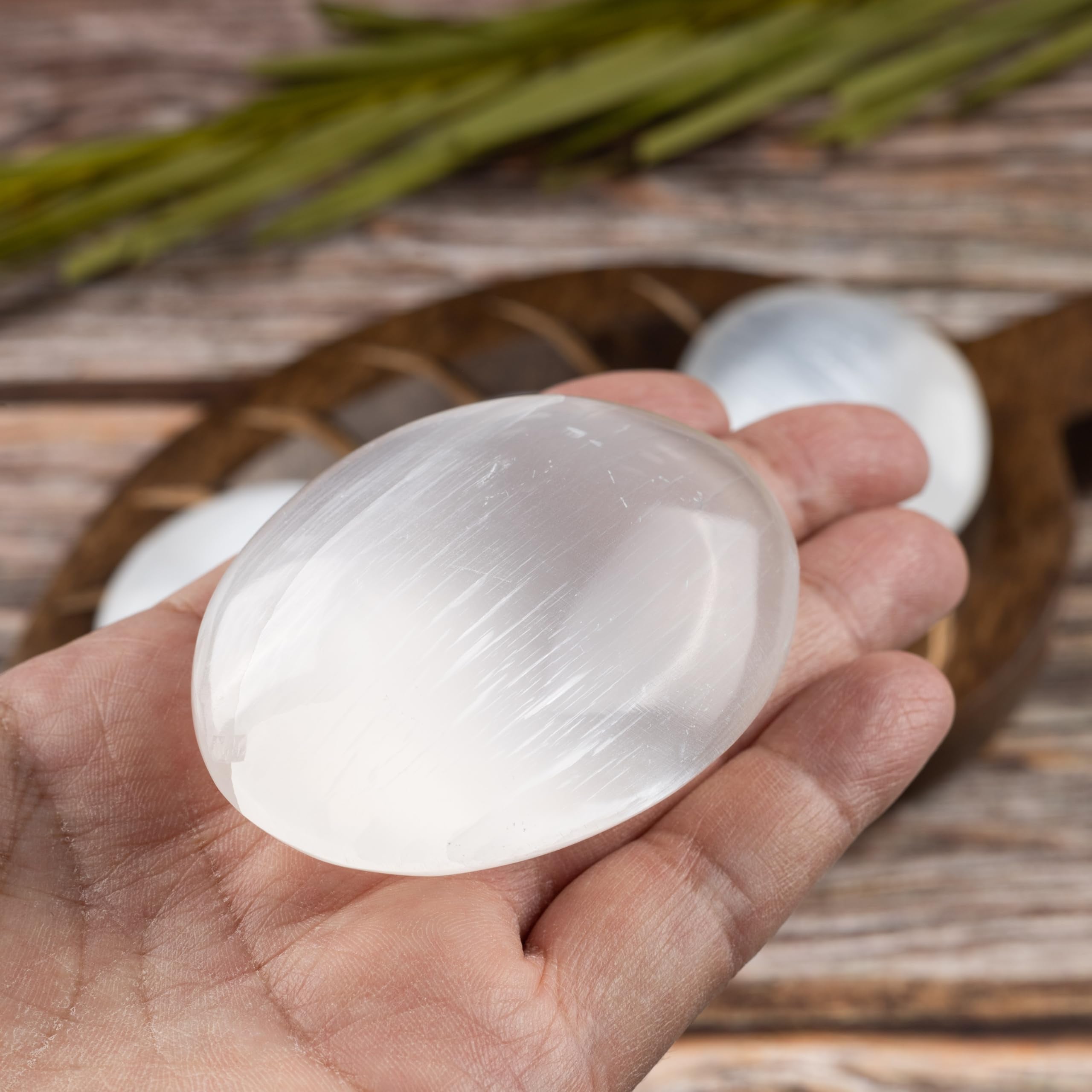 Wish Well selenite palm stone held during breathing exercises for balance.