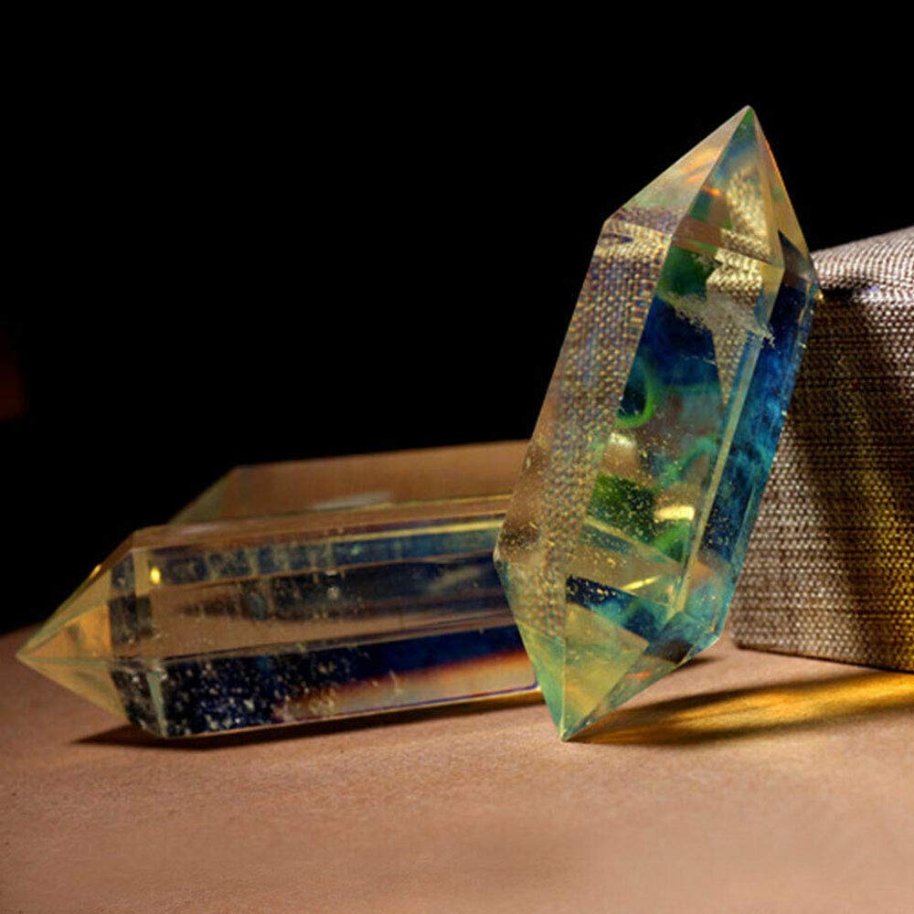 Wixine crystal wand as stylish paperweight with warm glow.