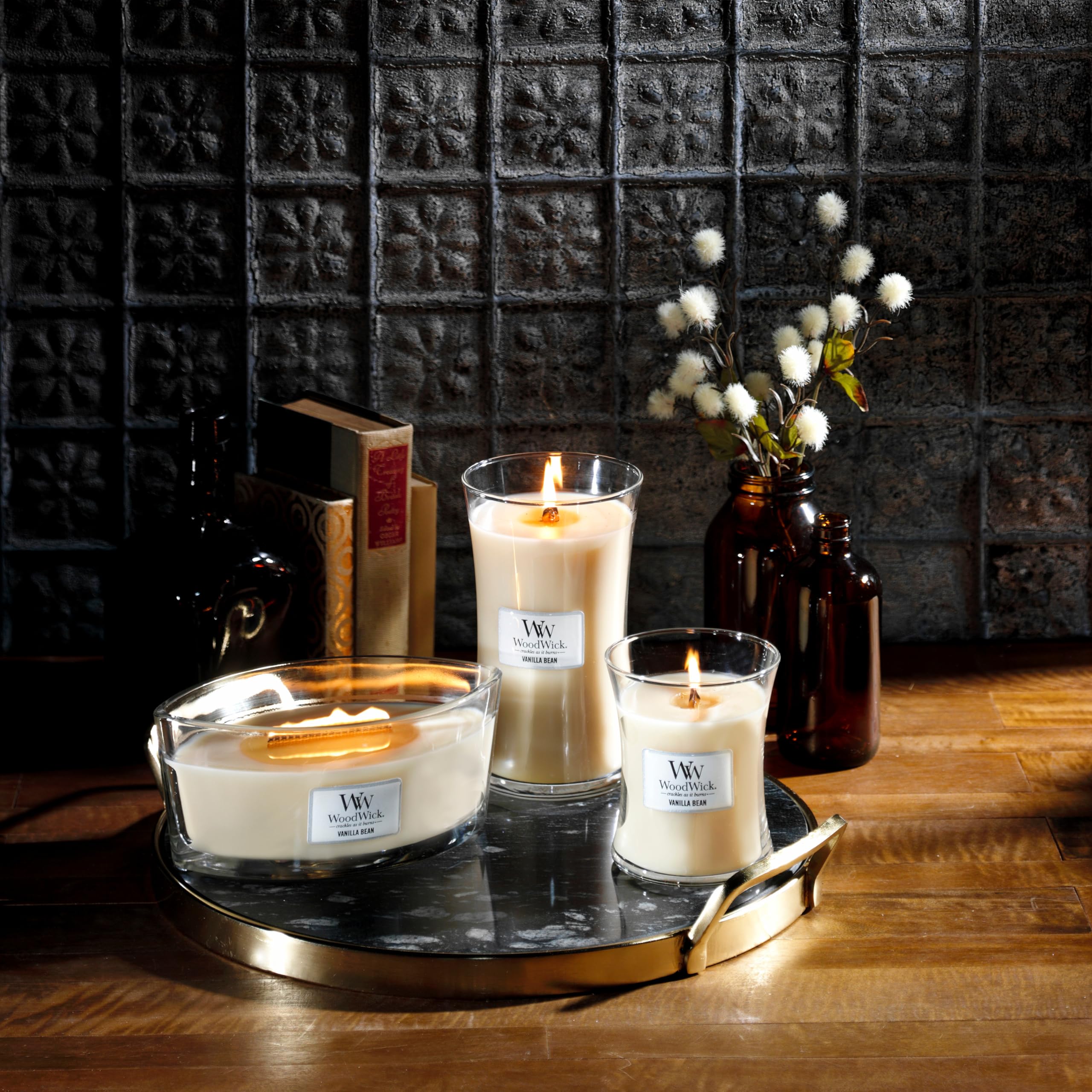 WoodWick Elipsa Vanilla Bean candle lit to evoke relaxing ambiance.