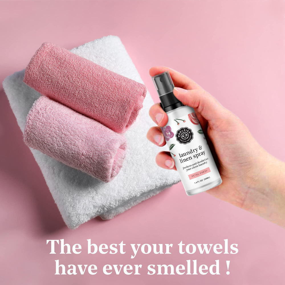 Woolzies Petal Fresh linen spray bottle adding floral aroma to fabrics.