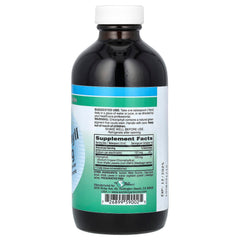 World Organic chlorophyll liquid pour into glass, convenient addition to smoothies.