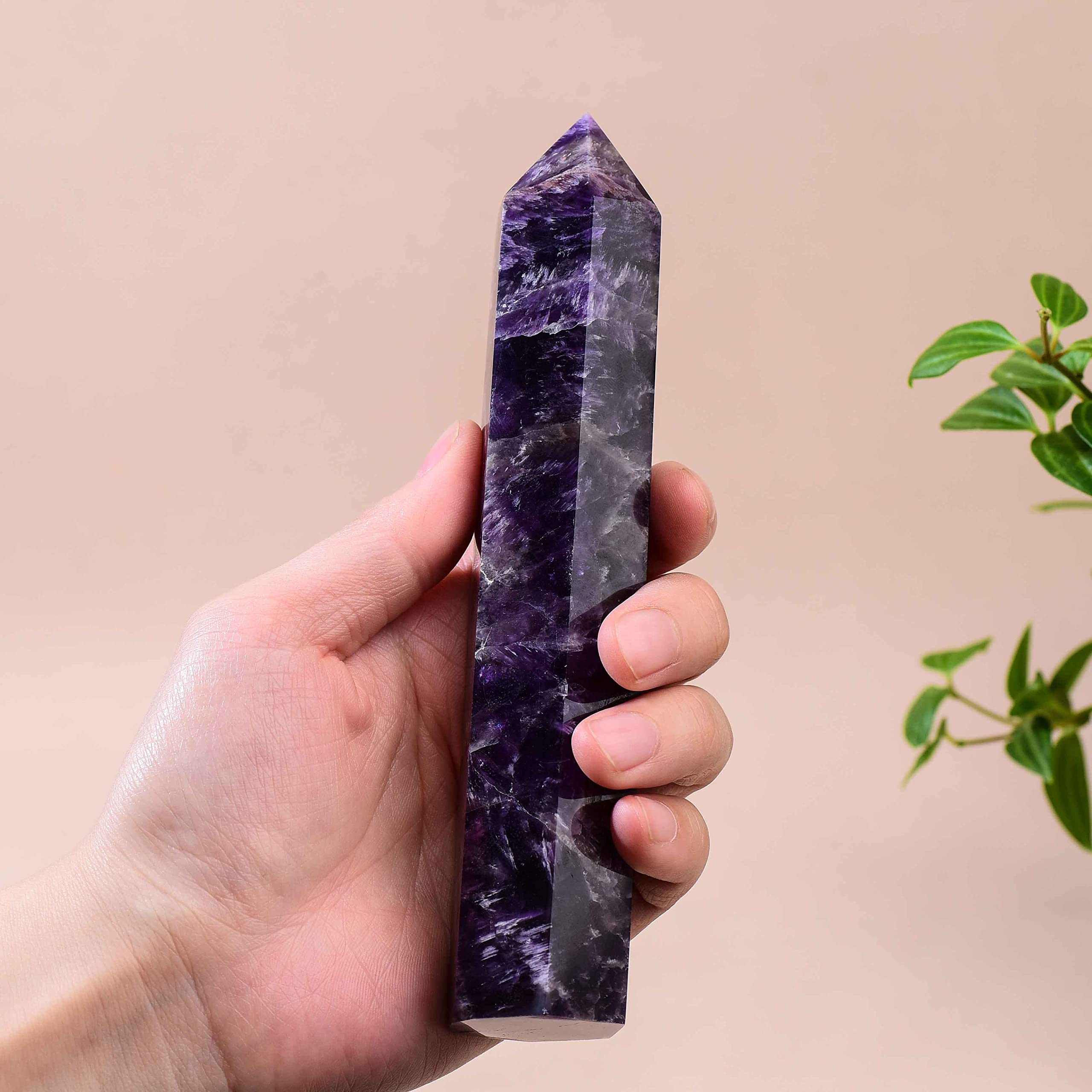 WUYOUSHI six-faceted chakra crystal point helps balance energy during practice.