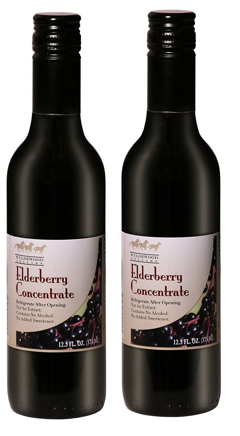 Wyldewood Elderberry concentrate bottle pour, easy to add to daily drinks.