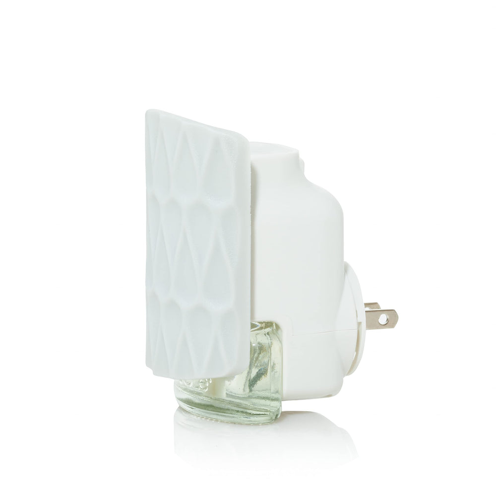 ScentPlug diffuser in living room creating inviting aroma for guests