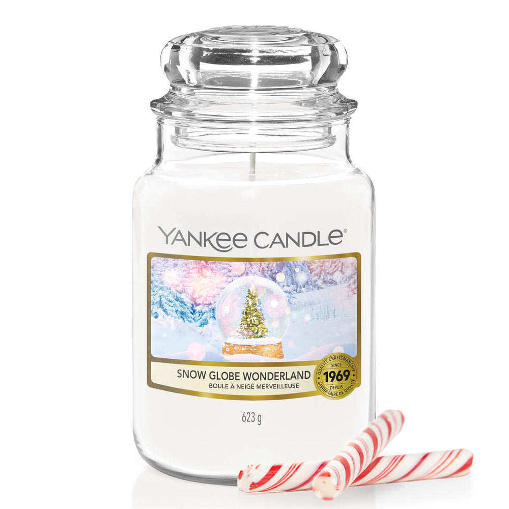 Yankee Candle Snow Globe Wonderland jar with shimmering snow for a festive living room focal point.