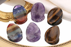YATOJUZI tigers-eye water-drop worry stone for grounding during tasks.