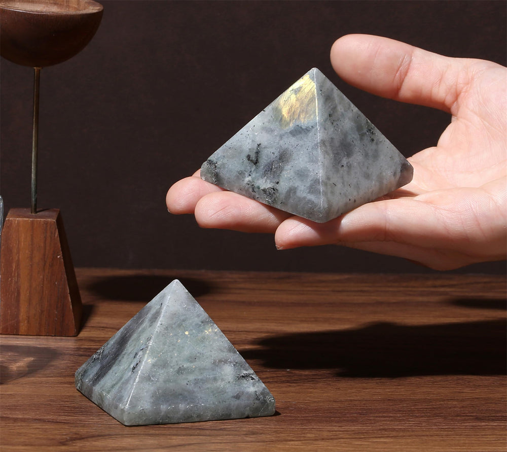 YATOJUZI White Labradorite crystal in hand demonstrating compact size for meditation