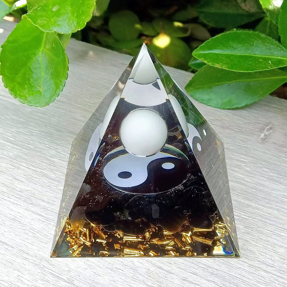 Ycyingcheng Moonstone Orgone Pyramid on desk enhances workspace ambiance and balance.