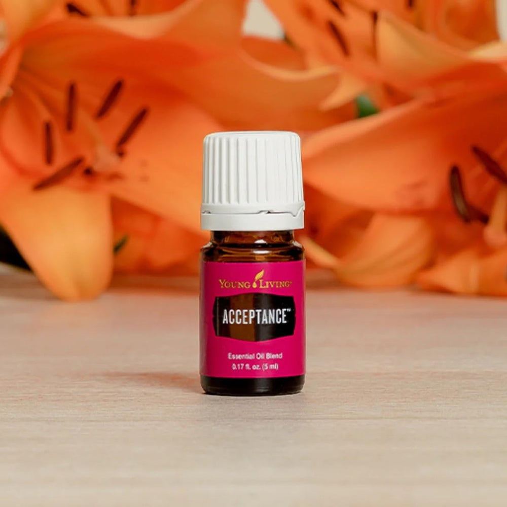Young Living Acceptance diffuser with drops, ideal for meditation ambience.