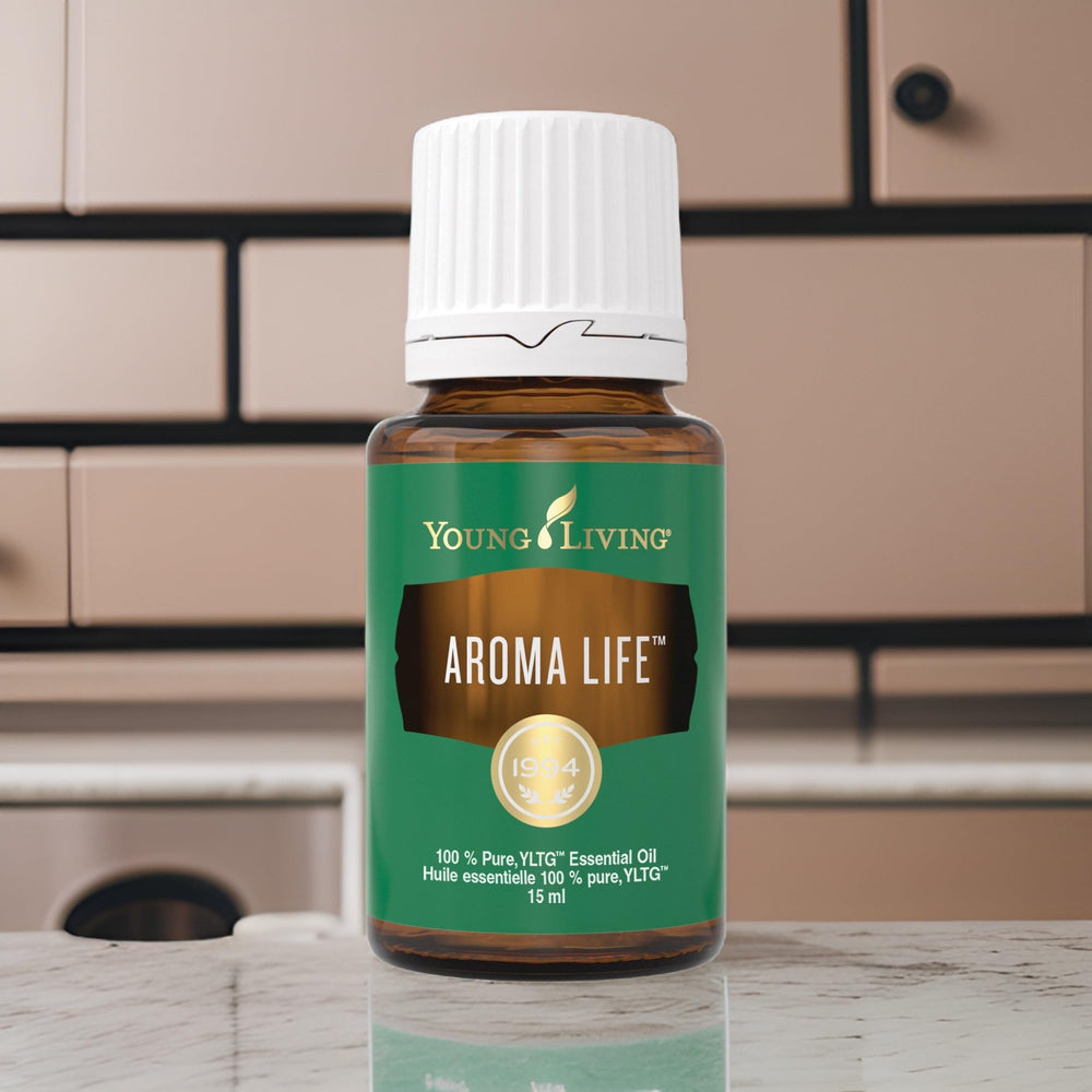 Pouring Aroma Life bottle to release calming drops for diffusion.