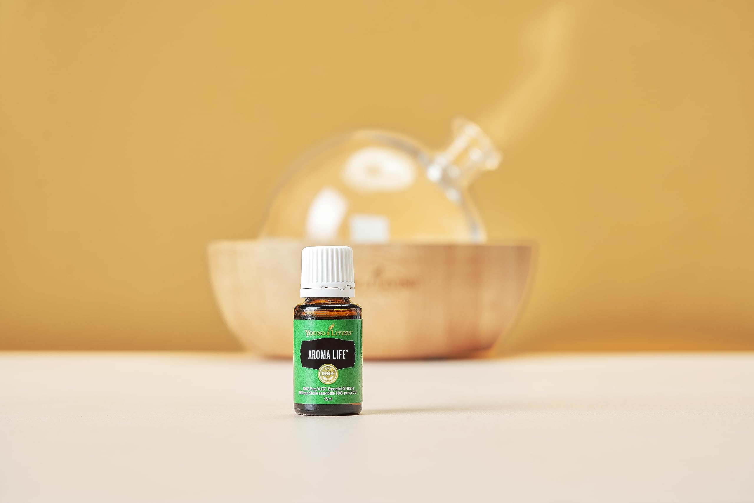 Aroma Life diffuser setup by Young Living in a serene home ambiance.
