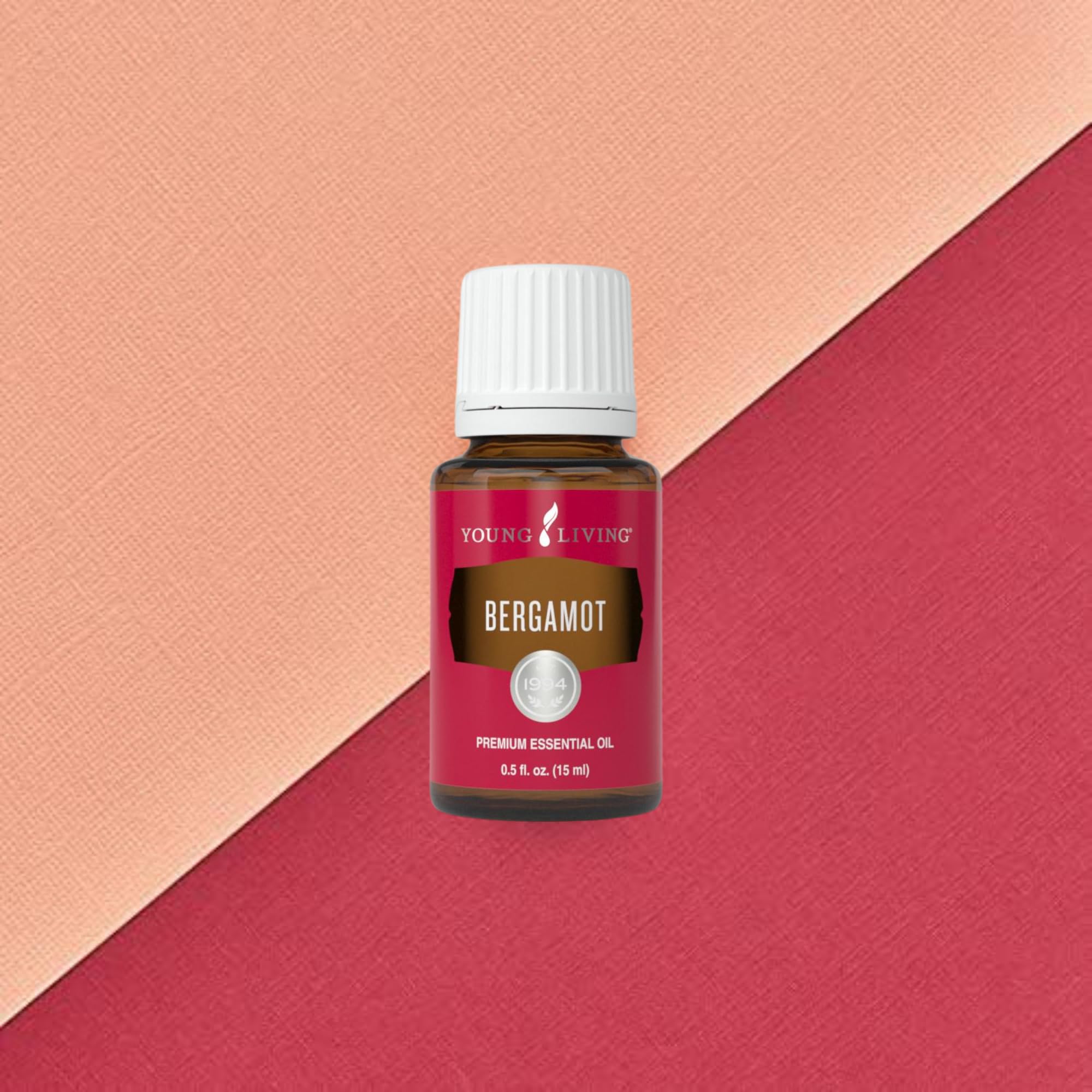 Young Living Bergamot Oil dropper highlighting purity for precise topical use.