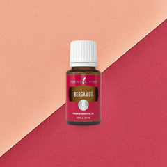 Young Living Bergamot Oil dropper highlighting purity for precise topical use.